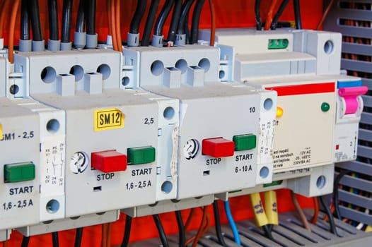 Electrical equipment. Automatic circuit breakers in a row. Electric switches in fusebox.