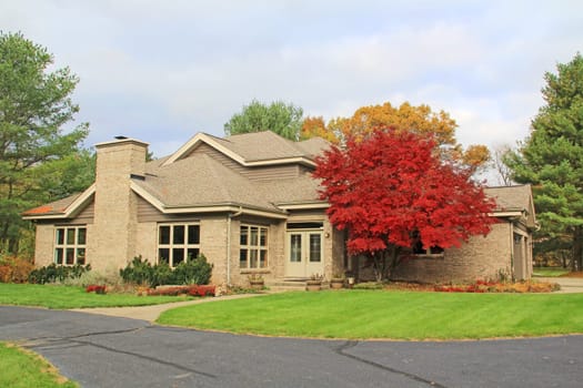 Single family brick contemporary home with a circle drive.