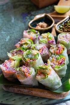Healthy fresh vegetable spring rolls serving, stock photo