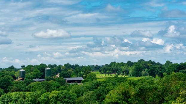 a panorama of french countryside with farm