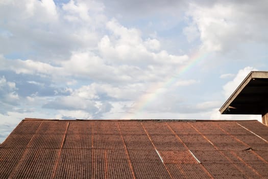 Vintage house roof with cloudy sky, stock photo