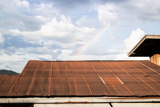 Vintage house roof with cloudy sky, stock photo
