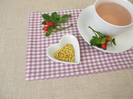 A cup of kernels tea from rose hip seeds