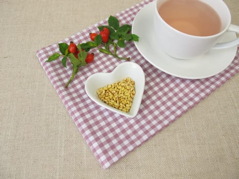 A cup of kernels tea from rose hip seeds