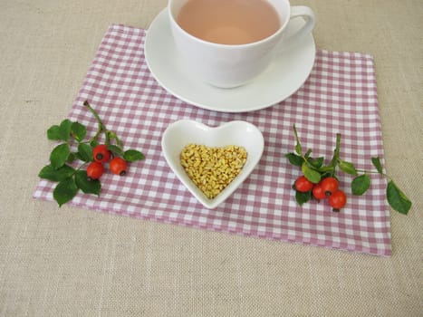 A cup of kernels tea from rose hip seeds