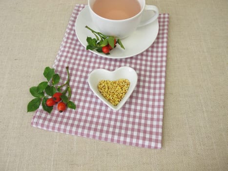 A cup of kernels tea from rose hip seeds