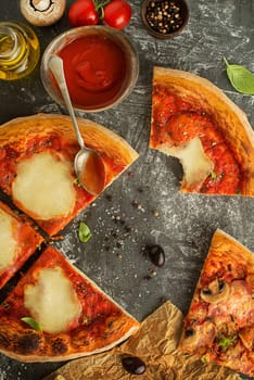Pizza slices served with fresh ingredients mozzarella cheese, ham, mushrooms and tomato sauce close up