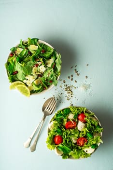 Healthy salads with spinach, cheese, tomato and seeds. Home made food. Concept for a tasty and healthy meal