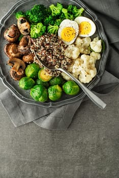 Healthy meal with cooked and roasted vegetables and quinoa seeds. Healthy vegetable diet meal.
