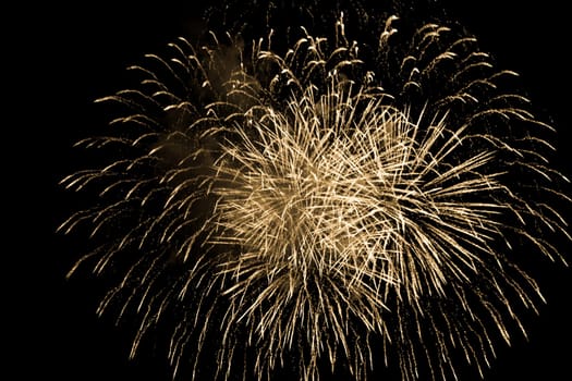 Premium entertainment magic star firework at e.g. New Years Eve or Independence Day party celebration. Black dark night background.