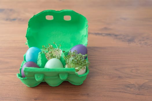 Beautiful decoration easternest basket with painted eggshells for celebration. Lovely traditional gift design on wooden background.