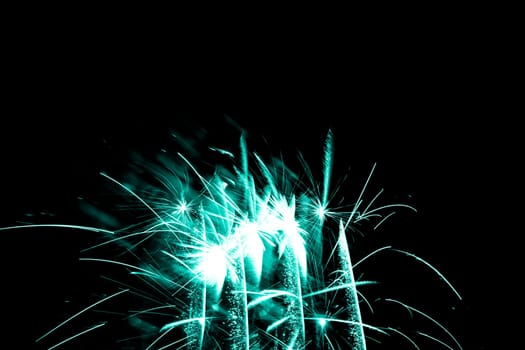 Premium entertainment magic star firework at e.g. New Years Eve or Independence Day party celebration. Black dark night background.
