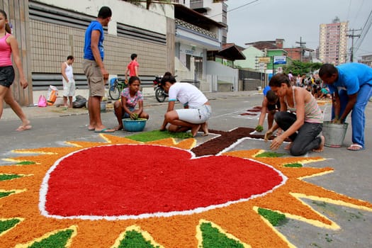 Itabuna, Bahia / Brazil - June 7, 2012: People are seen making traditional tapes during the Corpus Crist holiday festivities in Itabuna.