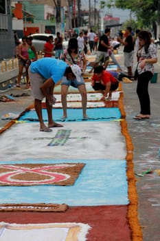 Itabuna, Bahia / Brazil - June 7, 2012: People are seen making traditional tapes during the Corpus Crist holiday festivities in Itabuna.