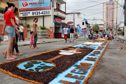Itabuna, Bahia / Brazil - June 7, 2012: People are seen making traditional tapes during the Corpus Crist holiday festivities in Itabuna.