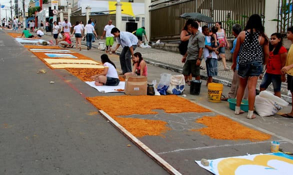 Itabuna, Bahia / Brazil - June 7, 2012: People are seen making traditional tapes during the Corpus Crist holiday festivities in Itabuna.