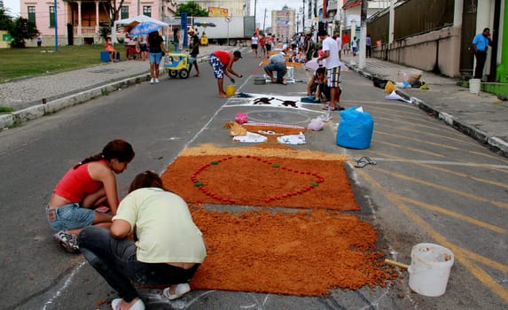 Itabuna, Bahia / Brazil - June 7, 2012: People are seen making traditional tapes during the Corpus Crist holiday festivities in Itabuna.
