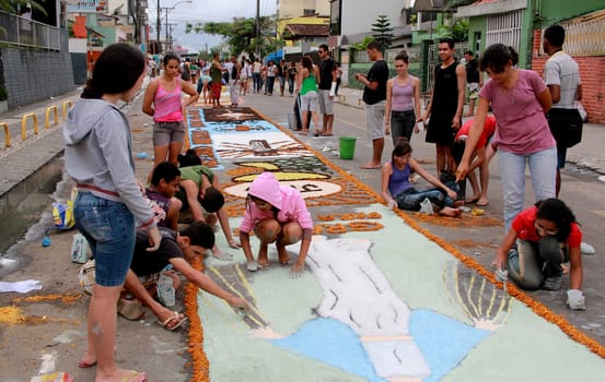 Itabuna, Bahia / Brazil - June 7, 2012: People are seen making traditional tapes during the Corpus Crist holiday festivities in Itabuna.