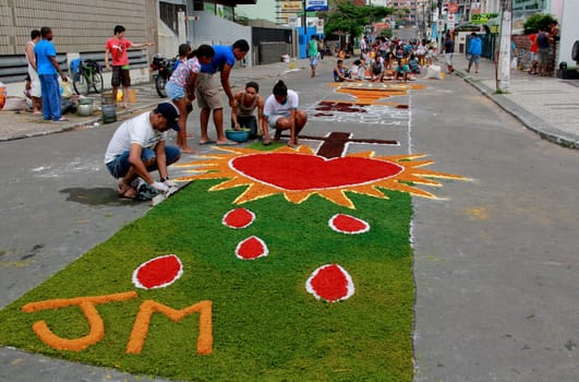 Itabuna, Bahia / Brazil - June 7, 2012: People are seen making traditional tapes during the Corpus Crist holiday festivities in Itabuna.