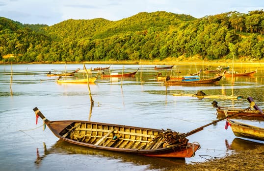 Thai long tail fishing boats at fishing village on Ko Yao Yai island in the Andaman Sea in Thailand
