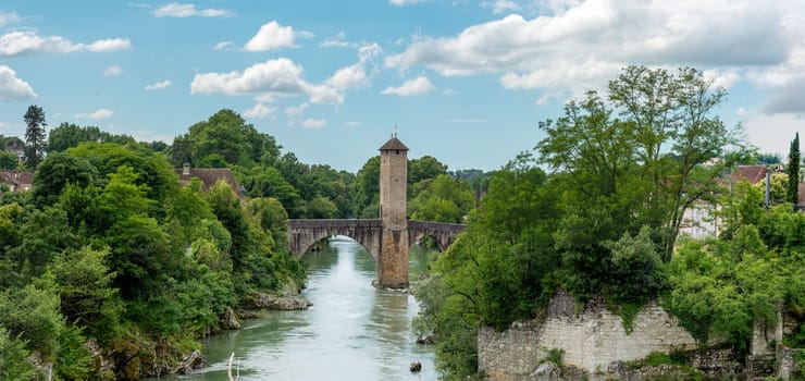 a medieval bridge over river Gave de Pau in Orthez - France