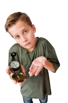 Wide-angle three-quarter view of a 12-year-old Caucasian boy with a compass on his right hand looking at the camera at a loss, isolated on white.