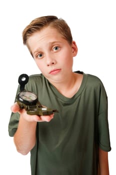 Wide-angle three-quarter view of a 12 year old Caucasian boy with a compass on his right hand looking at the camera at a loss, isolated on white.