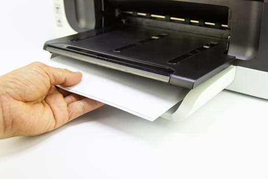hand man lay down the paper from printer in the office, Business concept