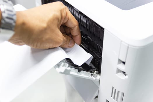Technicians Removing Paper Stuck, Paper Jam In Printer At Office