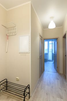 Entrance hall and corridor in the interior of an apartment in a multi-storey building