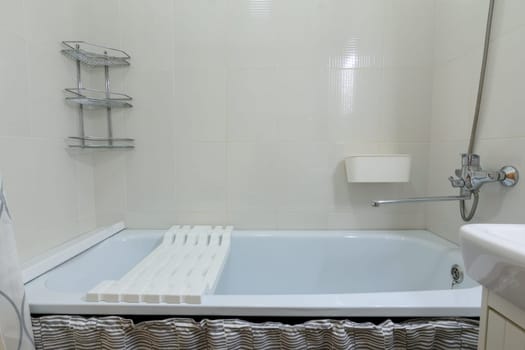 Small cozy bathroom, view of the bath