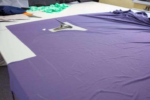 cut matter on a large table in the atelier