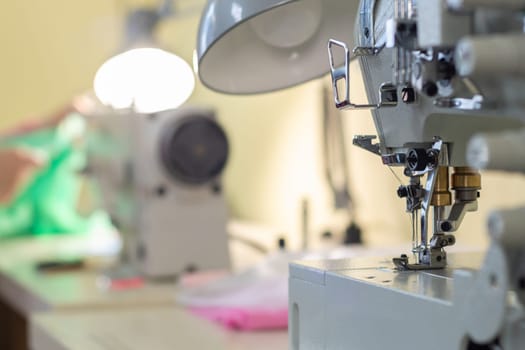close-up of the needle sewing machine in the workshop atelier