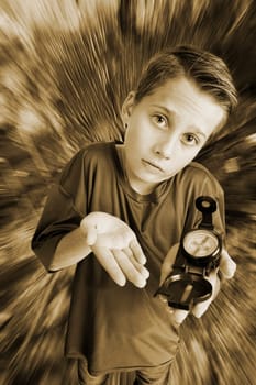 Monochrome image of a 12-year-old Caucasian boy in an elevated, wide-angle three-quarter view with a compass on his left hand, looking at the camera helplessly against a radially distorted background.