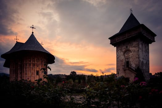 GURA HUMORULUI, ROMANIA - August 14 2019: The orthodox monastery Humor at sunset. UNESCO World Heritage Site. Suceava county, Romania.