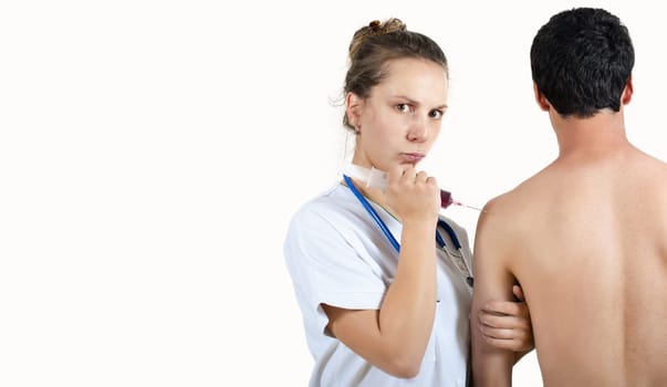 a young nurse doctor giving injection to patient, closeup