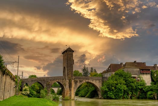 a medieval bridge over river Gave de Pau in Orthez - France