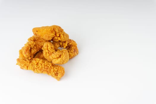 Fried breaded chicken fillet isolated on white background