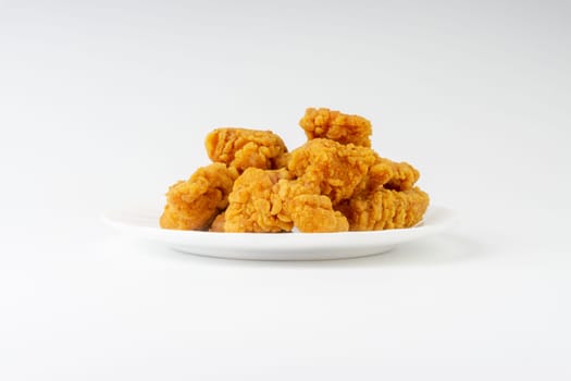 Fried breaded chicken fillet isolated on white background