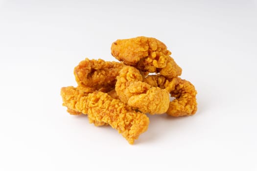 Fried breaded chicken fillet isolated on white background