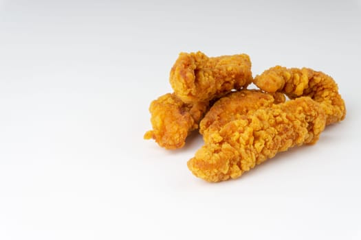 Fried breaded chicken fillet isolated on white background