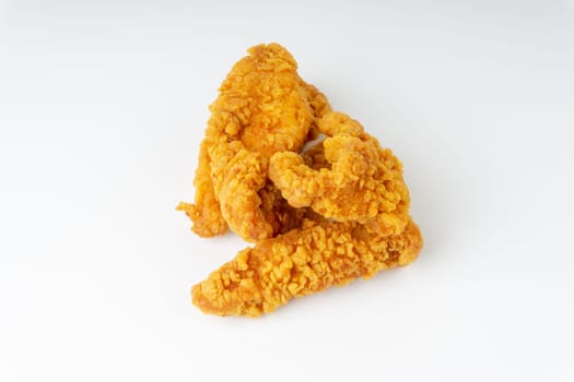 Fried breaded chicken fillet isolated on white background