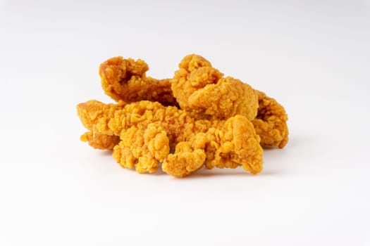 Fried breaded chicken fillet isolated on white background