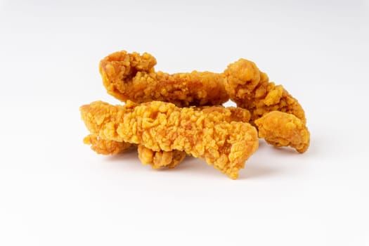 Fried breaded chicken fillet isolated on white background