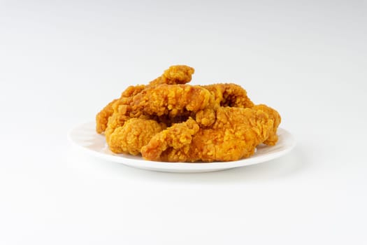 Fried breaded chicken fillet isolated on white background