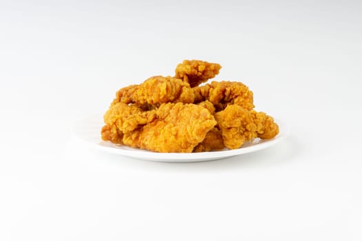 Fried breaded chicken fillet isolated on white background
