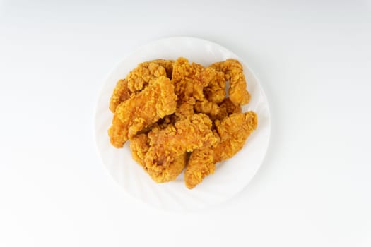 Fried breaded chicken fillet isolated on white background