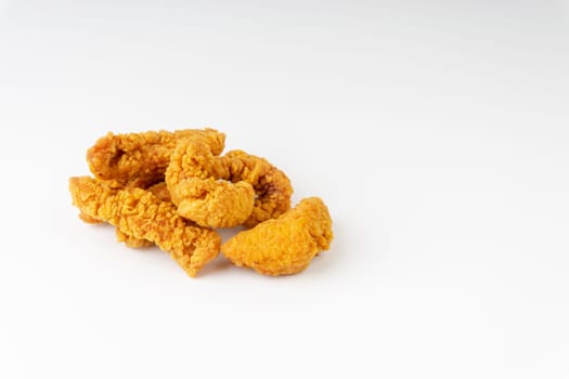 Fried breaded chicken fillet isolated on white background