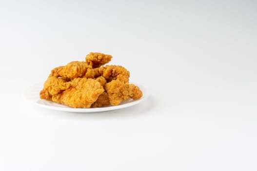 Fried breaded chicken fillet isolated on white background
