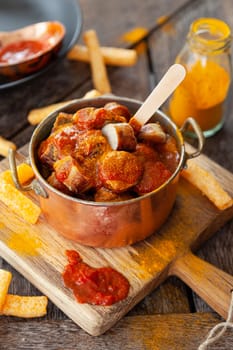 Delicious bratwurst with a spicy tomato curry sauce